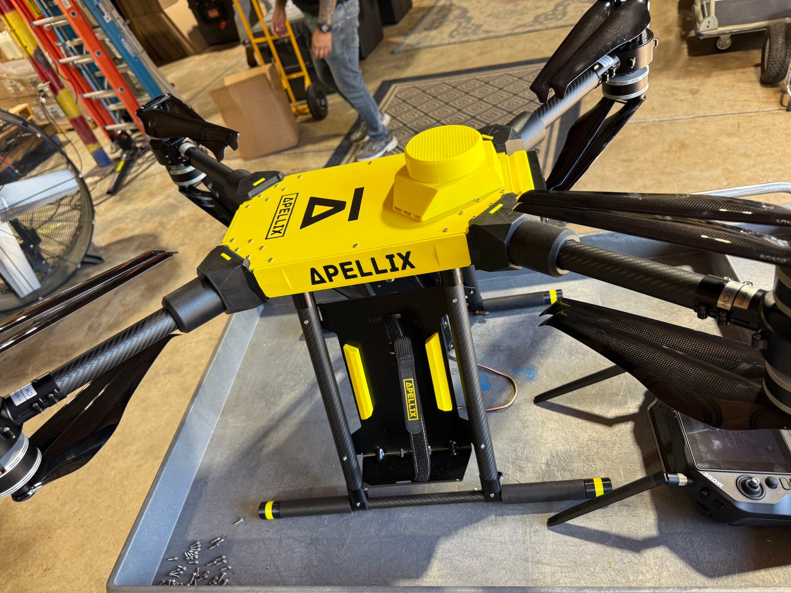 Yellow Apellix drone in a workshop- Wash me drone